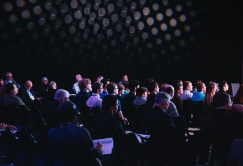 A crowd watches an ongoing performance.