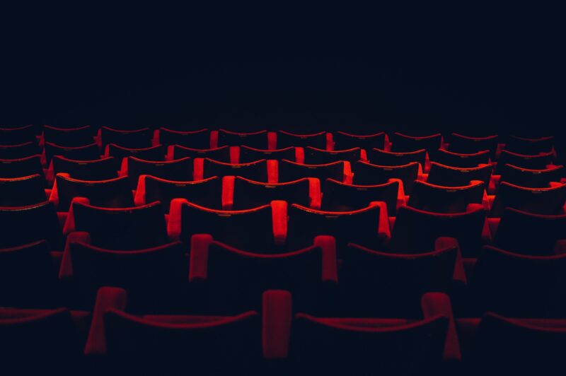 An empty theatre, illuminated only by a single light.
