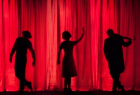 A group of performers getting ready before their play.