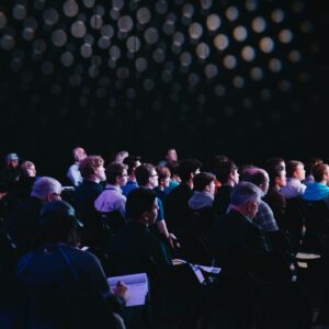 Audience at an ongoing meeting.