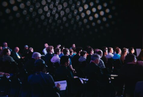 Audience at an ongoing meeting.