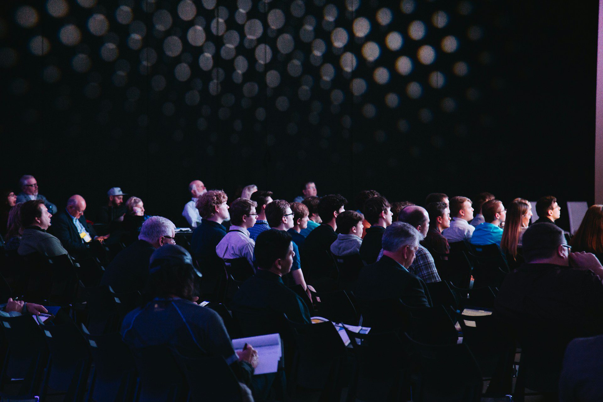 Audience at an ongoing meeting.