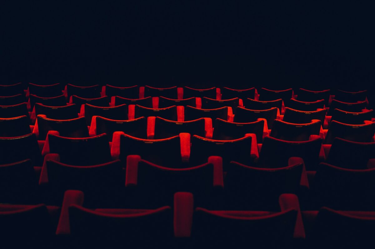 An empty theatre, illuminated only by a single light.