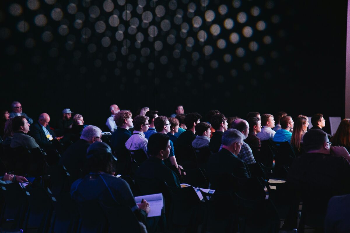 Audience at an ongoing meeting.