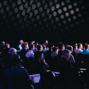 Audience at an ongoing meeting.