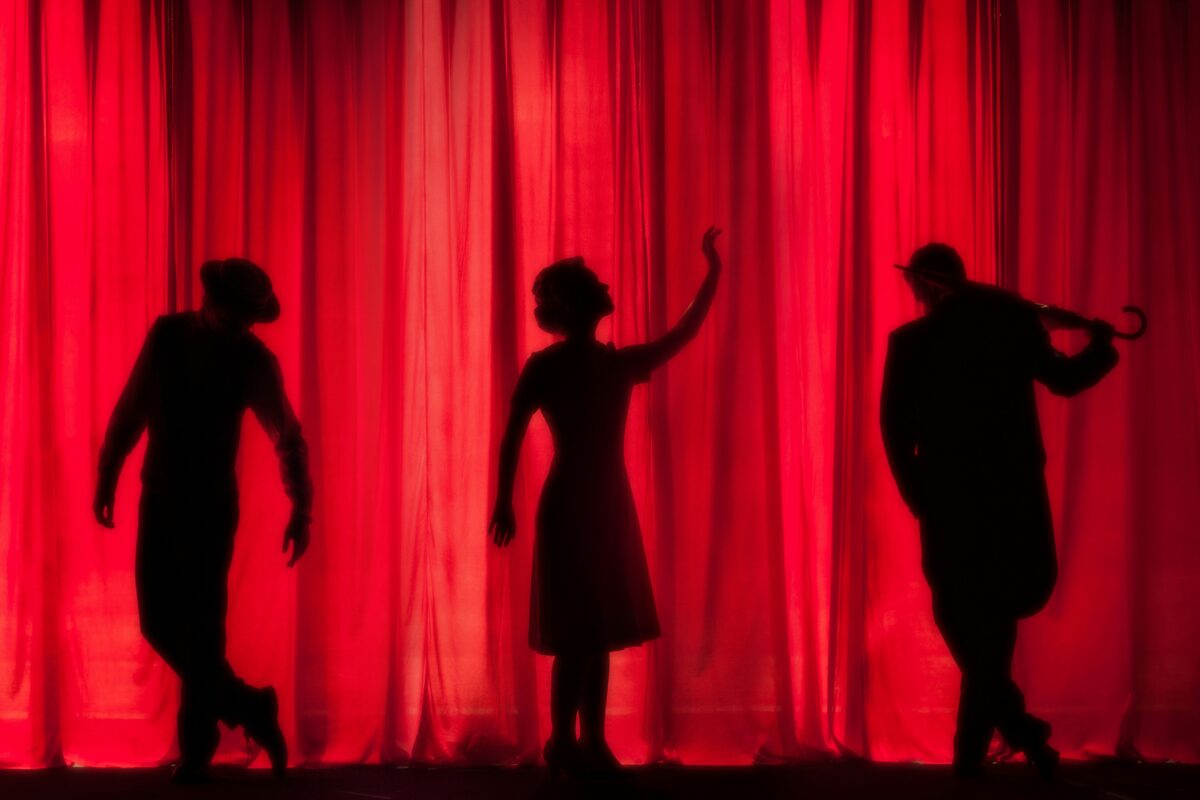 A group of performers getting ready before their play.