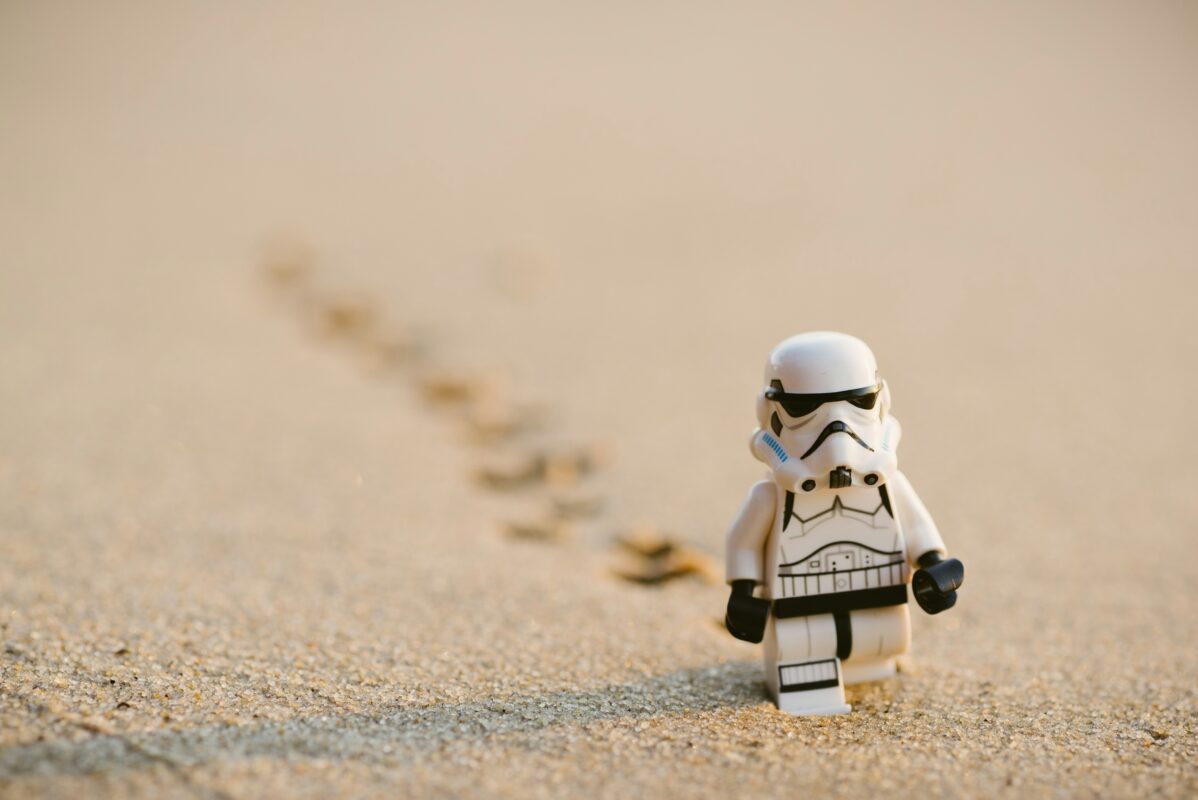 Star Wars Stormtrooper lego figurine walking in sand
