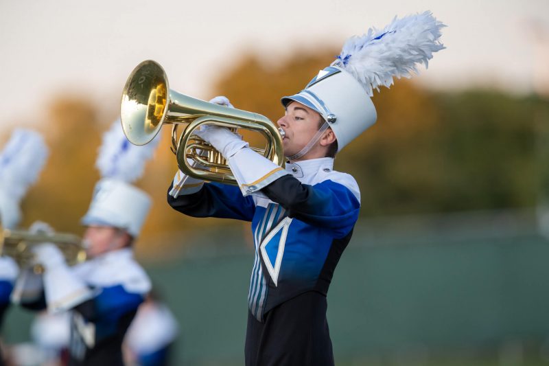 Boy is tootin that french horn.